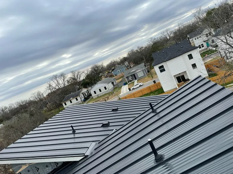 Standing seam metal roof panels with vents for Skylight Repair in Prairie Village